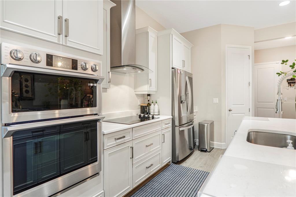 694 Brooks Field Drive Winter Garden, FL 34787 - Photo 33 of 74 a kitchen with stainless steel appliances a stove sink and refrigerator