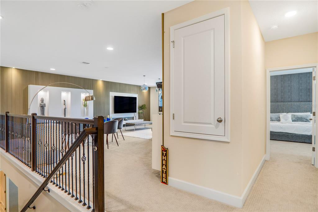 694 Brooks Field Drive Winter Garden, FL 34787 - Photo 45 of 74 a view of a hallway with dining area and chandelier