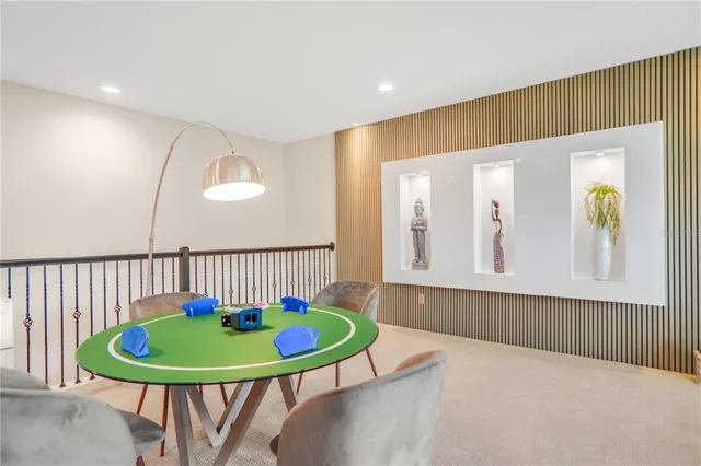 a living room with a couch and a chandelier