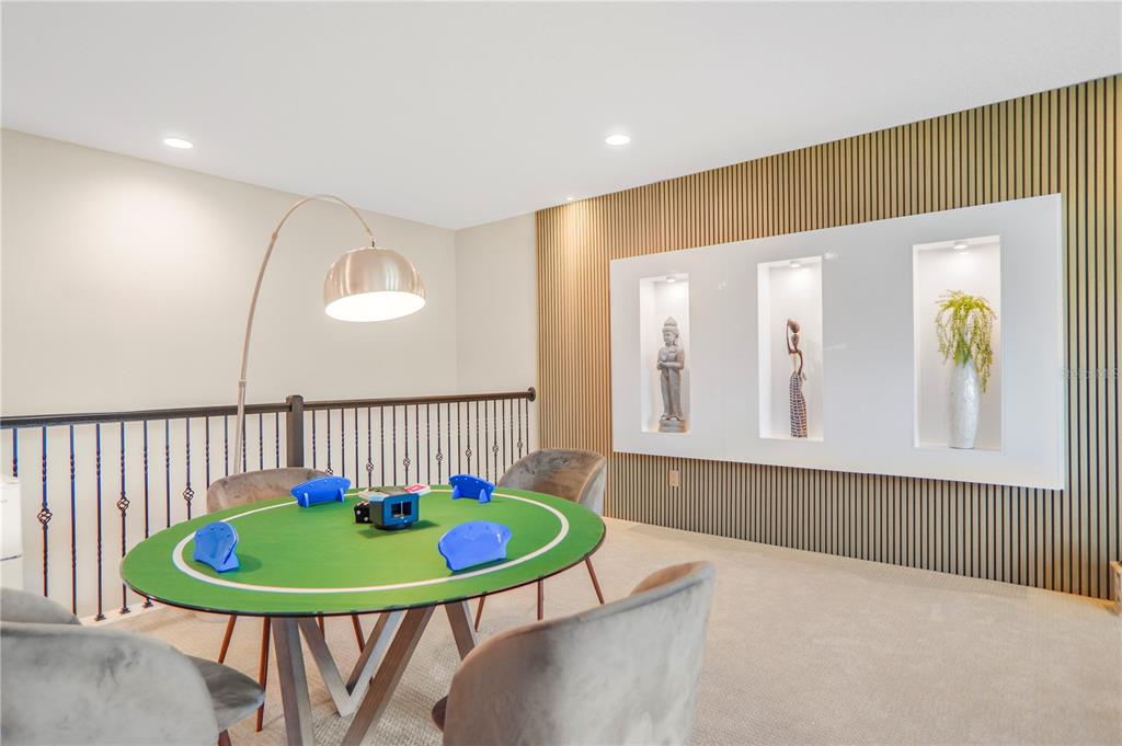 694 Brooks Field Drive Winter Garden, FL 34787 - Photo 48 of 74 a view of a bedroom with furniture and wooden floor