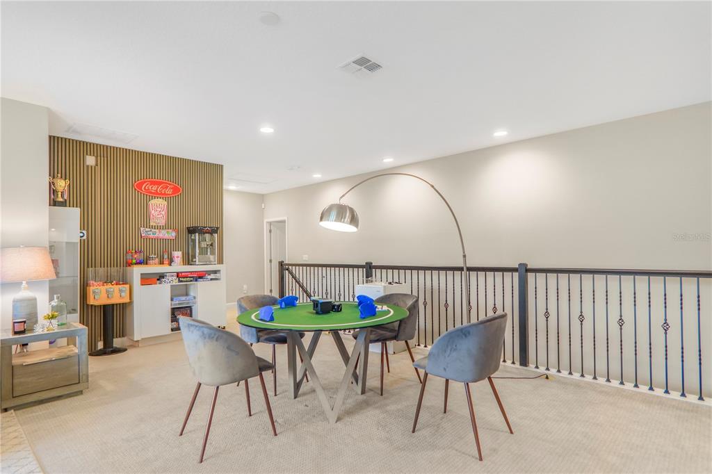 694 Brooks Field Drive Winter Garden, FL 34787 - Photo 49 of 74 a living room with furniture and a potted plant