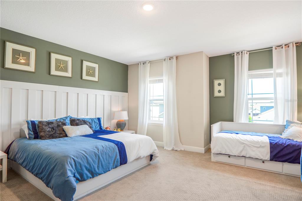 694 Brooks Field Drive Winter Garden, FL 34787 - Photo 56 of 74 a bedroom with a bed and a night stand