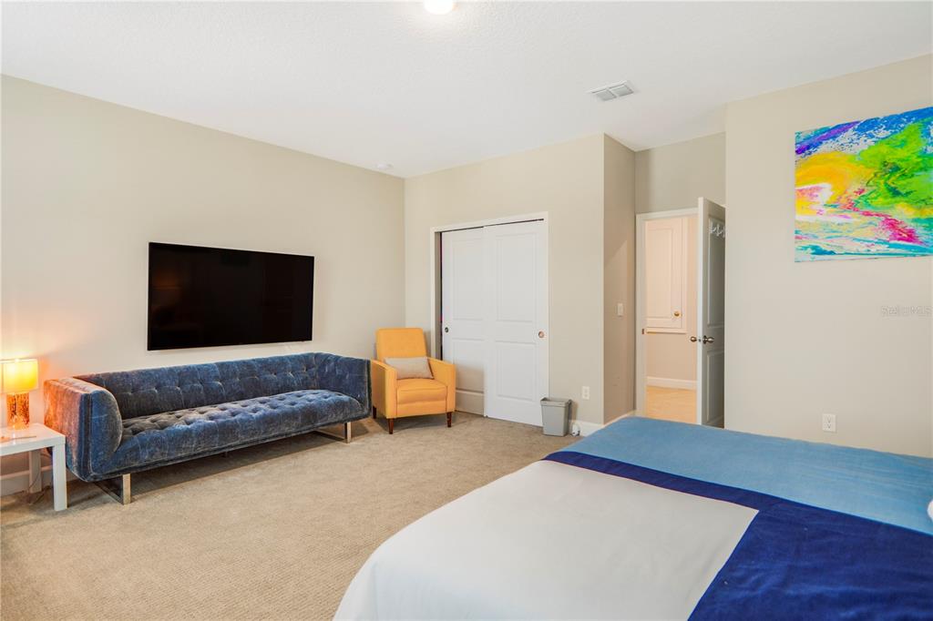 694 Brooks Field Drive Winter Garden, FL 34787 - Photo 58 of 74 a bedroom with a bed and a couch