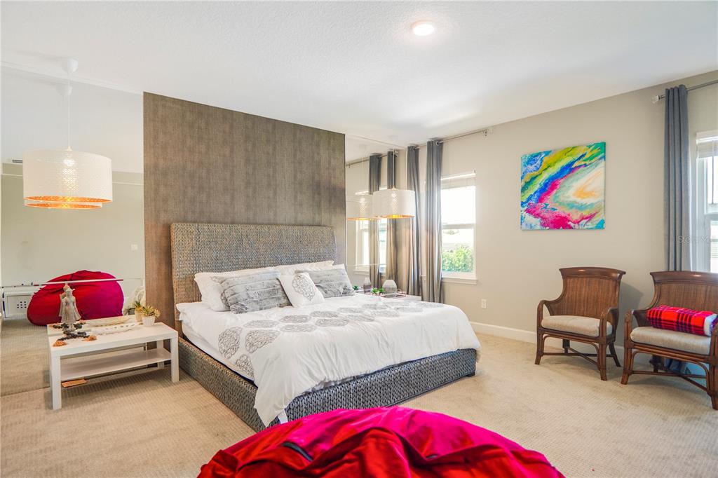 694 Brooks Field Drive Winter Garden, FL 34787 - Photo 60 of 74 a bedroom with a bed and a couch