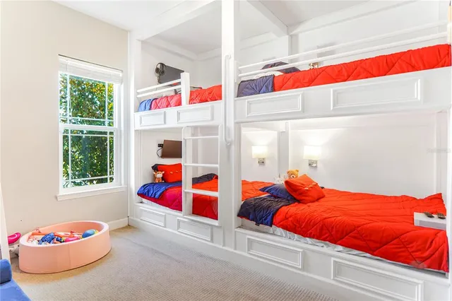 a room with a book shelf and a couch