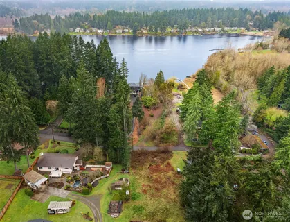 an aerial view of a house with a lake view