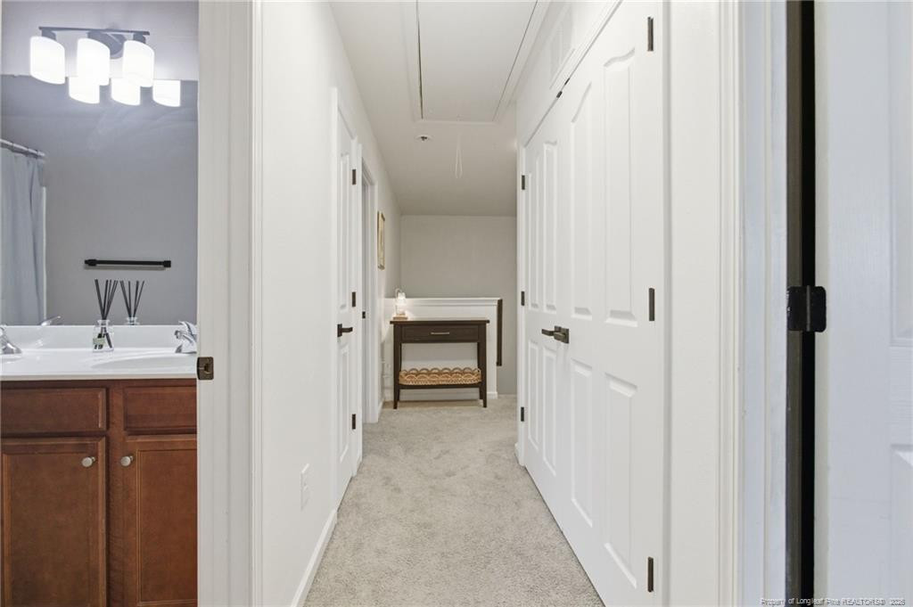 334 Crane Way Bunnlevel, NC 28323 - Photo 23 of 45 a view of a room with a sink and mirror