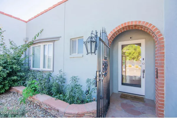 a front view of a house with garden