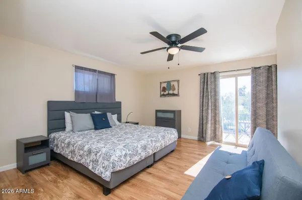 a bedroom with a large bed and a window