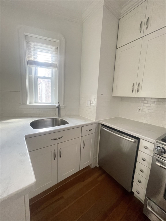 145 Charles Street, Unit 4 Boston, MA 02114 - Photo 15 of 24 a kitchen with sink cabinets and appliances