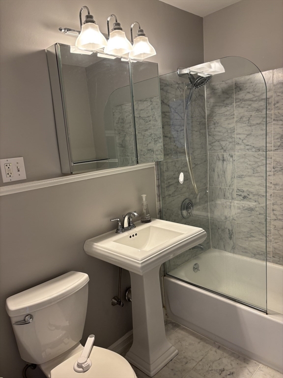 145 Charles Street, Unit 4 Boston, MA 02114 - Photo 19 of 24 a bathroom with a sink toilet and shower