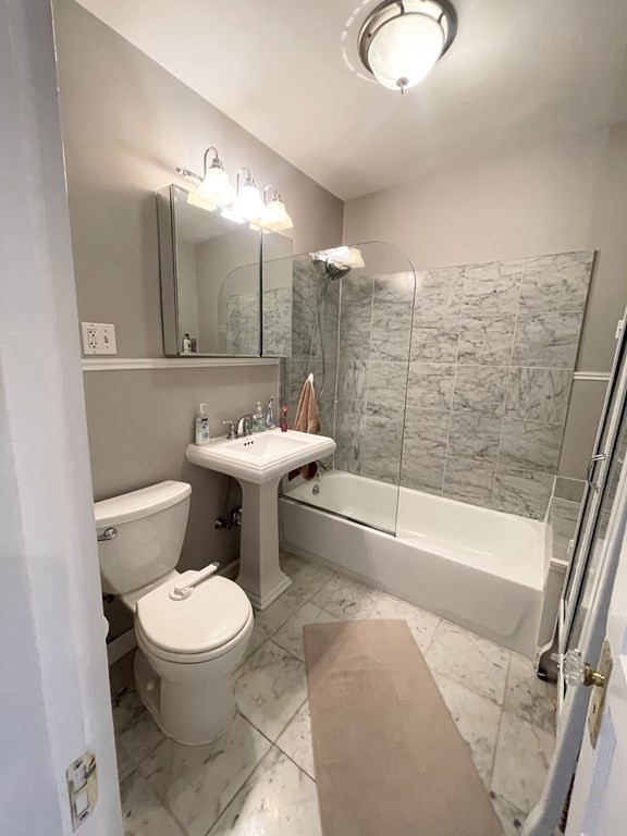 145 Charles Street, Unit 4 Boston, MA 02114 - Photo 20 of 24 a bathroom with a sink toilet and shower