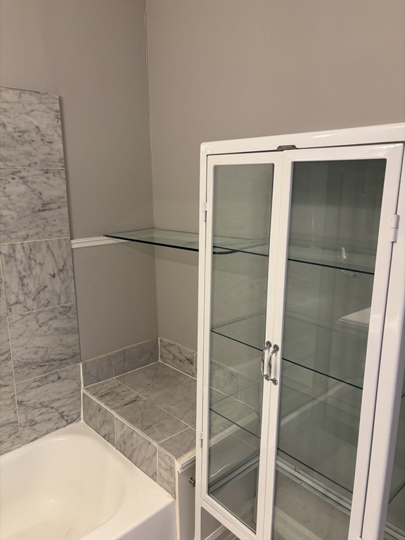 145 Charles Street, Unit 4 Boston, MA 02114 - Photo 21 of 24 a bathroom with a bathtub