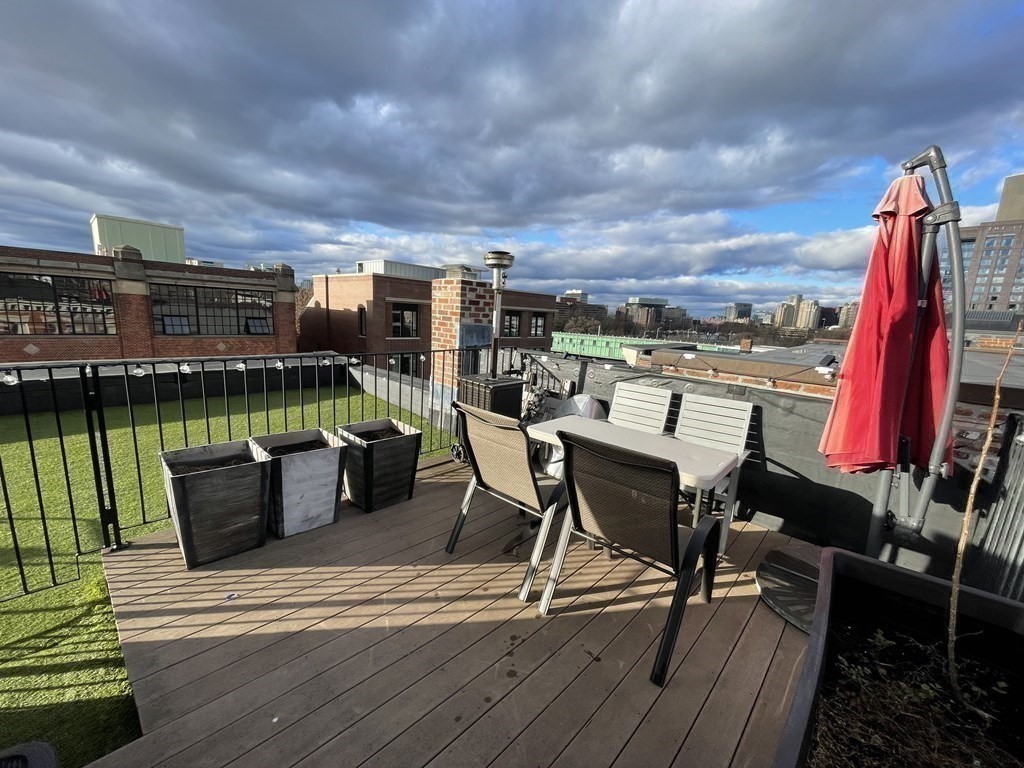 145 Charles Street, Unit 4 Boston, MA 02114 - Photo 23 of 24 a view of a chairs and table in the terrace