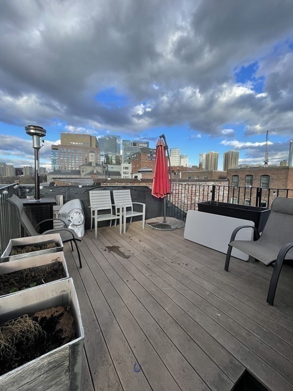145 Charles Street, Unit 4 Boston, MA 02114 - Photo 24 of 24 a view of a terrace with seating area