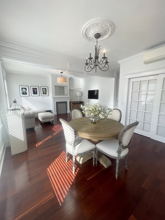 145 Charles Street, Unit 4 Boston, MA 02114 - Photo 5 of 24 a view of a dining room with furniture and wooden floor