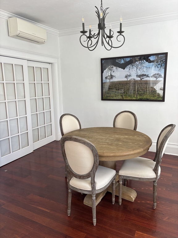 145 Charles Street, Unit 4 Boston, MA 02114 - Photo 7 of 24 a view of a dining room with furniture and wooden floor