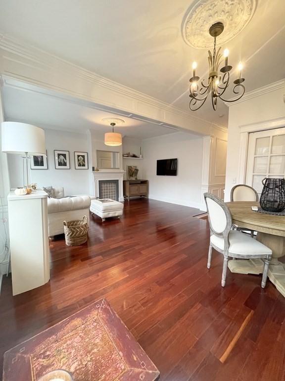145 Charles Street, Unit 4 Boston, MA 02114 - Photo 8 of 24 a living room with furniture and a wooden floor