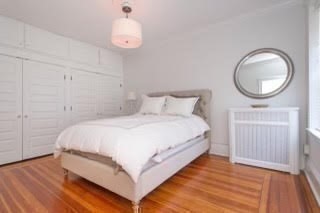 145 Charles Street, Unit 4 Boston, MA 02114 - Photo 10 of 24 a bedroom with a bed and a window