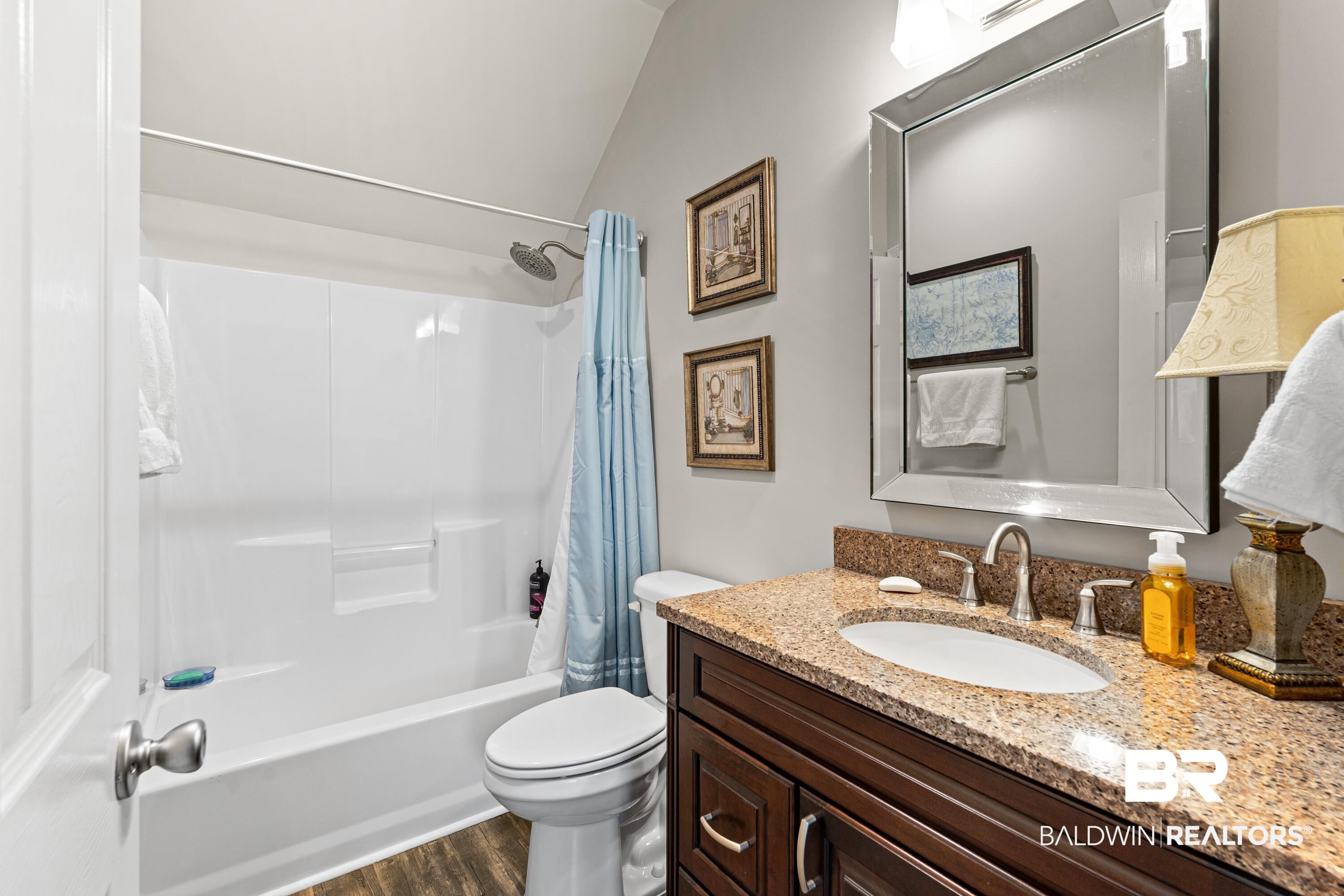 1113 Yellow Daisy Lane Foley, AL 36535 - Photo 24 of 35 Bathroom with shower / tub combo, vanity, and wood finished floors