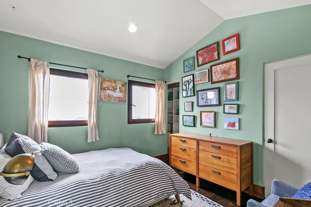 a bedroom with a large bed and a window