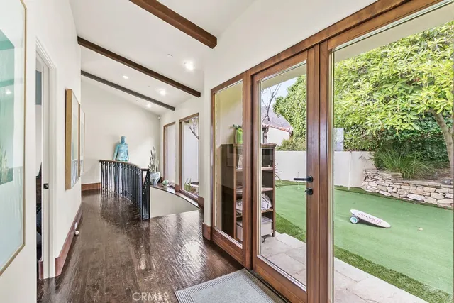 a bedroom with a large bed and a large window