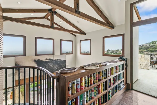 a view of a terrace with furniture and city view