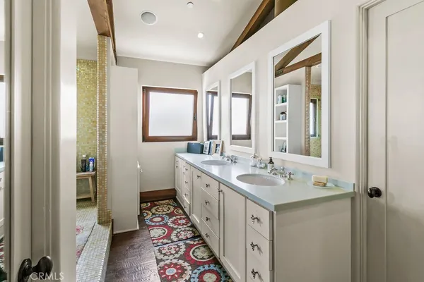a bathroom with a sink a mirror and a bathtub