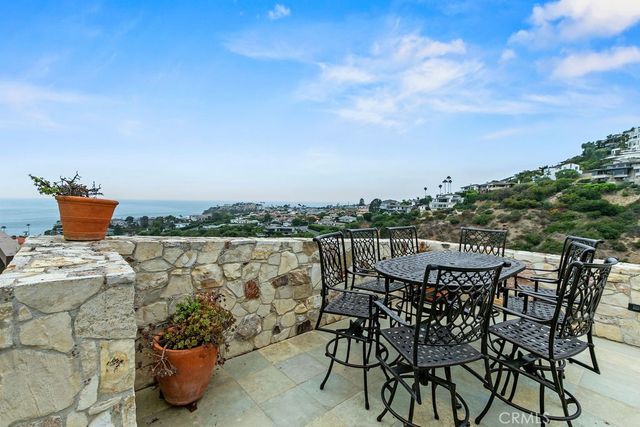 a room with pool table and next to a window
