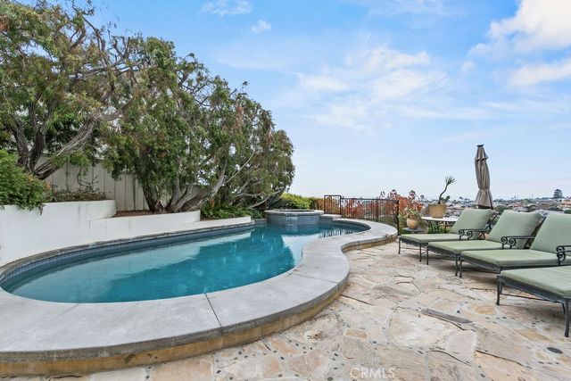 a kitchen with stainless steel appliances granite countertop a sink dishwasher and cabinets with wooden floor