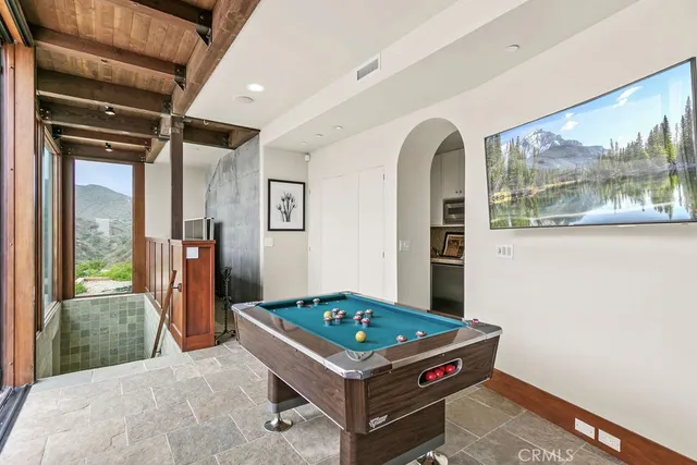 a dining room with furniture a window and wooden floor