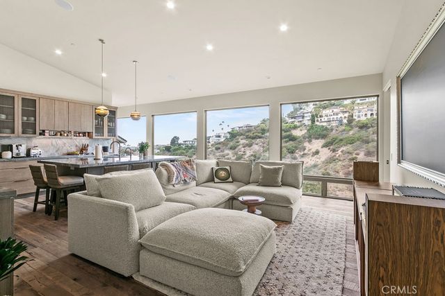 a view of a terrace with couches and wooden fence