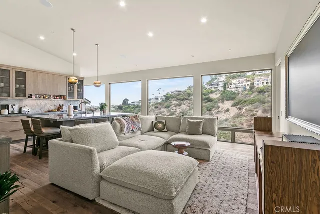 a view of a terrace with couches and wooden fence