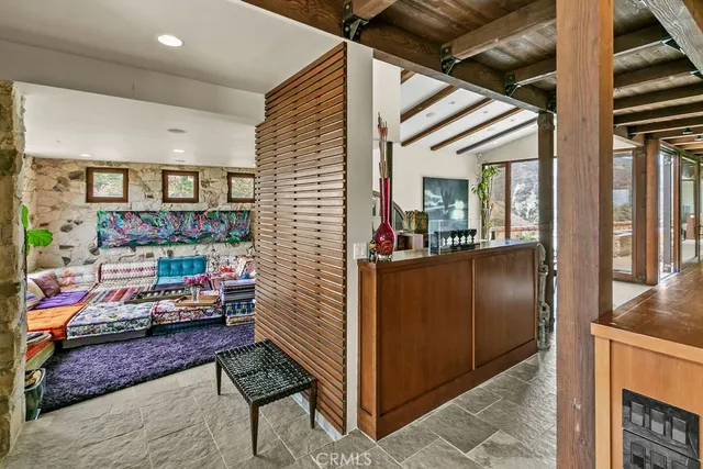a dining room with furniture and a chandelier