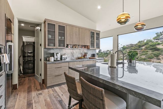 a view of a roof deck with a couches and city view