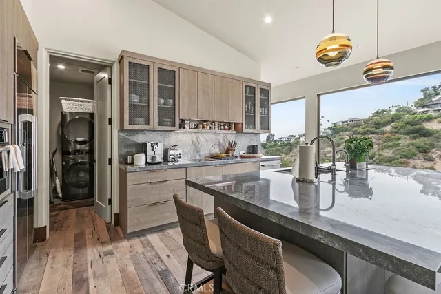 a view of a roof deck with a couches and city view