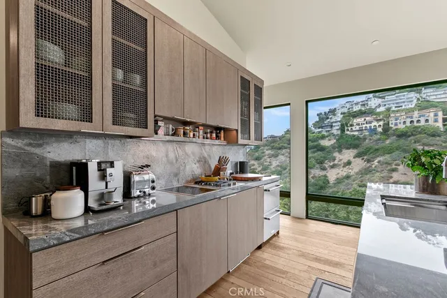 a view of a patio with table and chairs with wooden floor and fence