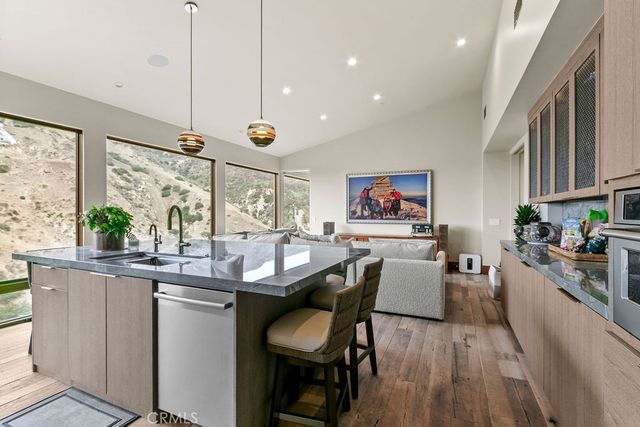 a view of a chairs and tables in the balcony