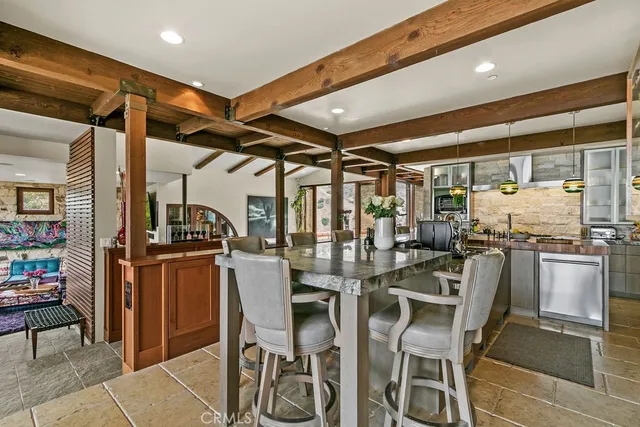 a view of a living room and chandelier