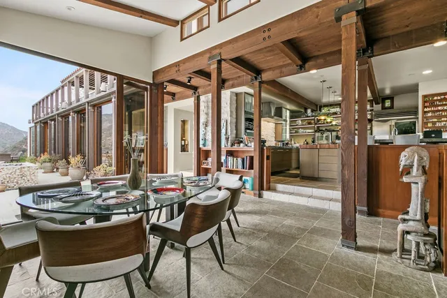 a view of a dining room with furniture window and outside view
