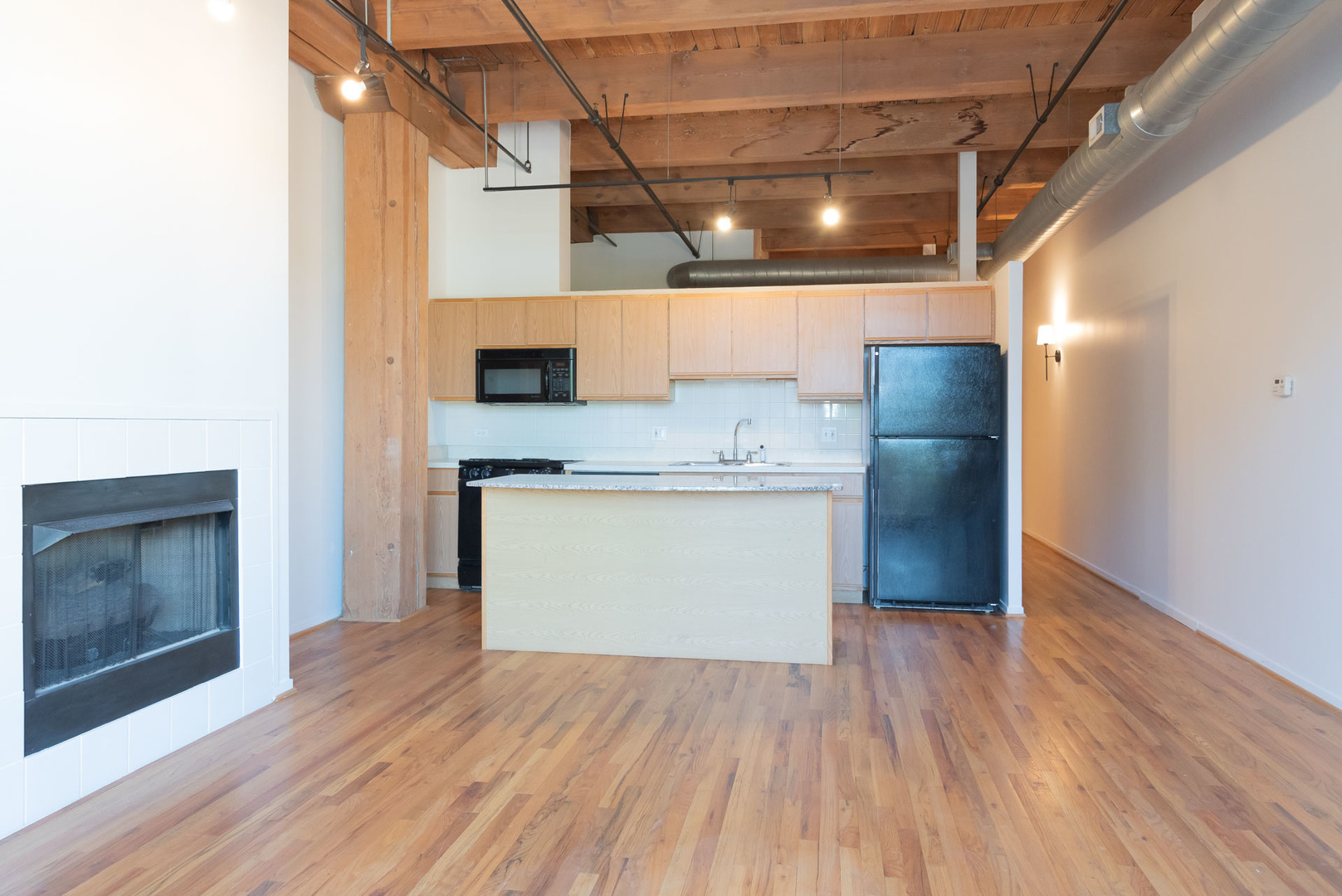 1250 West Van Buren Street, Unit 203 Chicago, IL 60607 - Photo 4 of 15 a view of a room with wooden floor