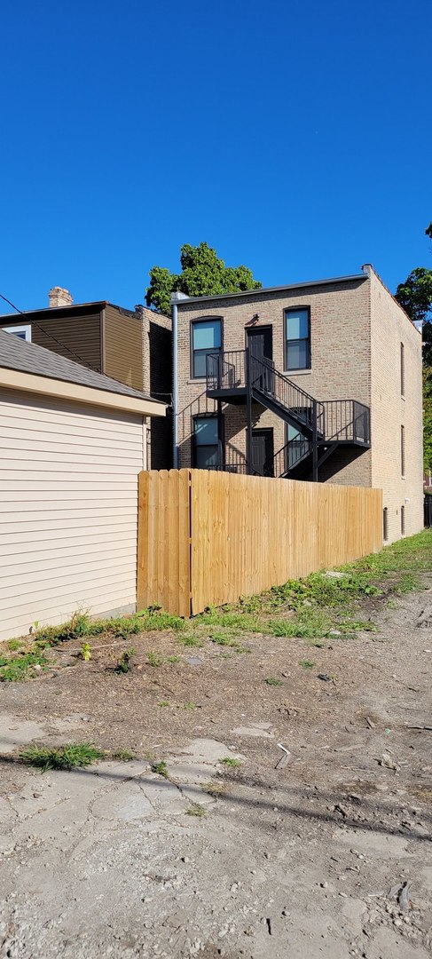 4105 West Cermak Road Chicago, IL 60623 - Photo 14 of 14 a front view of a house with a yard