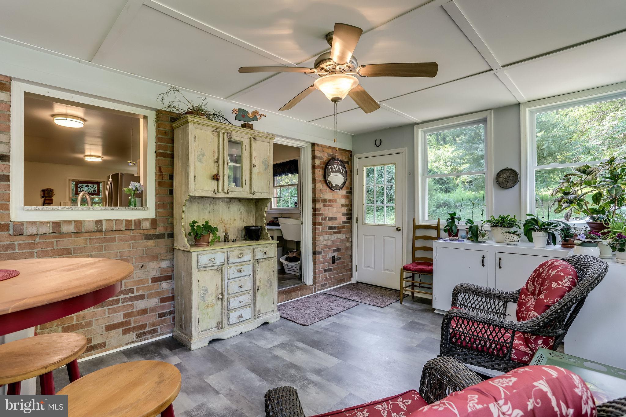 5538 Beverleys Mill Road Broad Run, VA 20137 - Photo 33 of 69 Sun Room with Kitchen Server Window