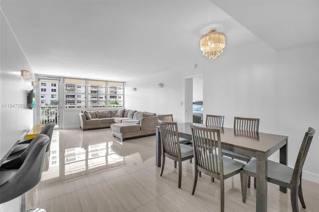 a kitchen with a refrigerator and a sink