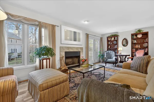 a living room with furniture and a fireplace