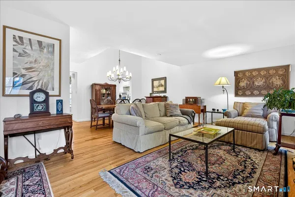 a living room with furniture or couch and a dining table