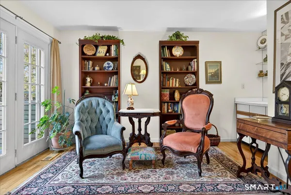 a living room with furniture and a chair