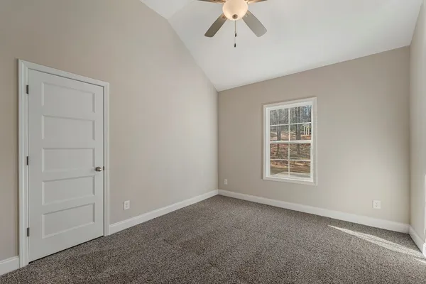 an empty room with a empty space and windows