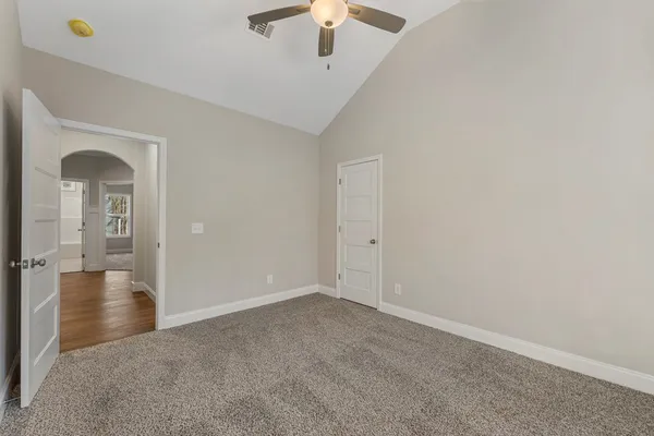 a view of a livingroom with a chandelier fan
