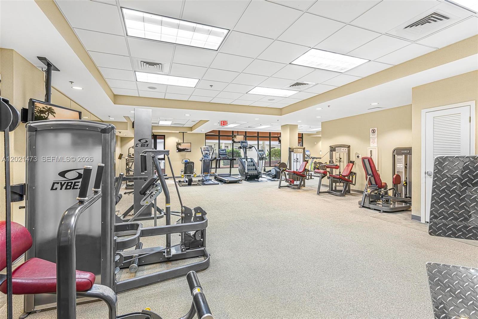 8395 Southwest 73rd Avenue, Unit 710 Miami, FL 33143 - Photo 28 of 32 a view of a room with gym equipment
